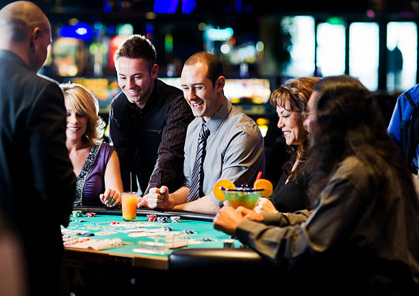 Multi-camera live dealer studio showing roulette wheel and dealer interface